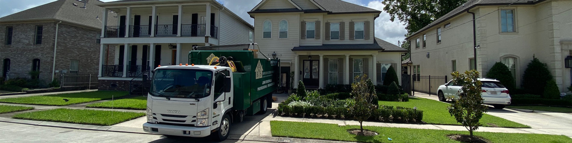 Junk Removal Truck in a Covington Neighborhood Completing Junk Removal Work